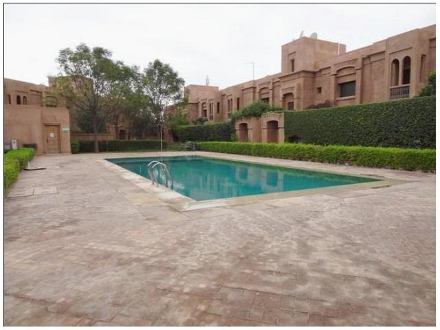Superbe appartement avec jardin et piscine