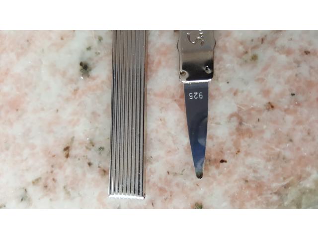 Photo Cure dents de poche, très petite lame en argent massif (925), incluse dans un support métallique arg image 2/2