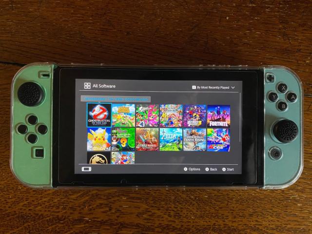 Photo Nintendo switch avec 14 jeux et accessoires image 2/2